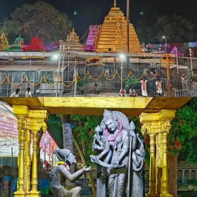 Night view of a beautifull illuminated golden pillars of lord shiva srisailam